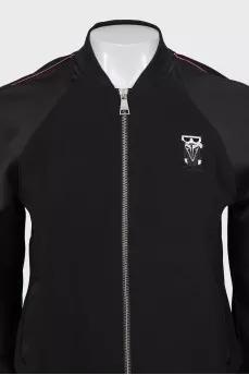 A suit consisting of a T-shirt, jacket, and trousers with trim