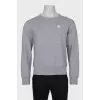 Men's gray sweatshirt with a patch