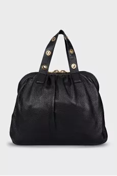 Leather bag with decorated handles