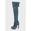 Leather over-the-knee boots decorated with buckles