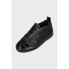 Black sneakers with patent toes