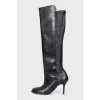 Black leather boots with a zipper