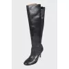 Black leather boots with a zipper