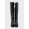 Black leather boots with a zipper