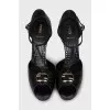Black leather sandals with gold decor