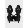 Black leather sandals with gold decor
