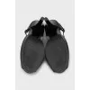 Black leather sandals with gold decor