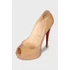 Beige high-heeled shoes