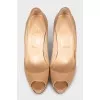 Beige high-heeled shoes