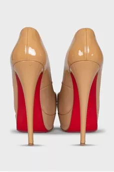 Beige high-heeled shoes