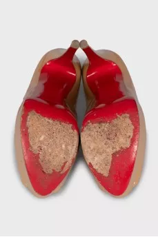 Beige high-heeled shoes