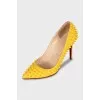 Yellow leather pumps with studs