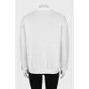White jumper with a contrasting print