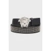 Rivet belt and proprietary buckle