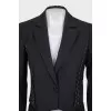 A cropped jacket decorated with chains