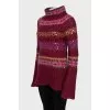 Long sweater decorated with sequins