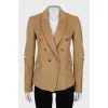 Wool jacket with holes on the sleeves