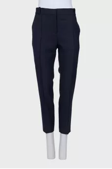 Tapered blue trousers with creases