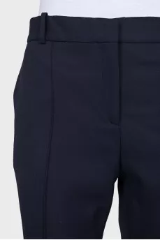 Tapered blue trousers with creases