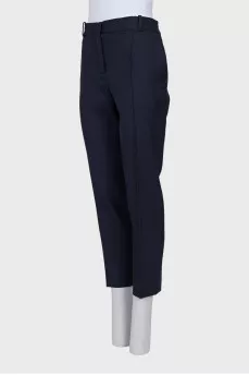 Tapered blue trousers with creases