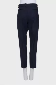 Tapered blue trousers with creases