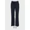 Flared trousers with a bow