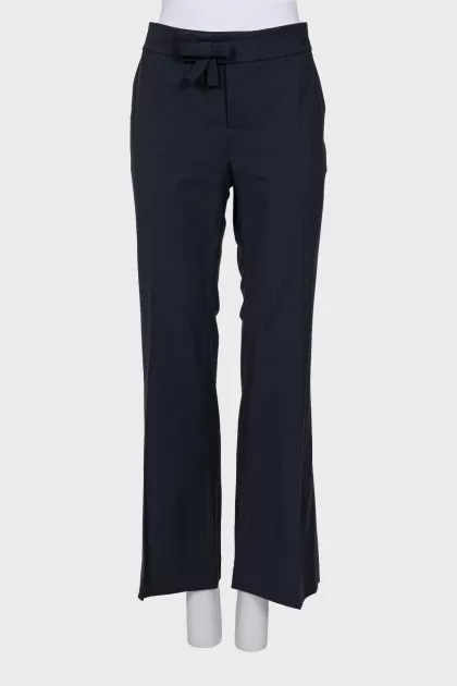 Flared trousers with a bow