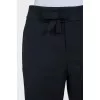Flared trousers with a bow