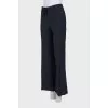 Flared trousers with a bow