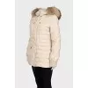 Fitted down jacket with raccoon fur