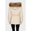 Fitted down jacket with raccoon fur