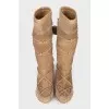 Suede boots decorated with pom-poms