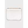 White bag with a gold logo