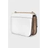 White bag with a gold logo