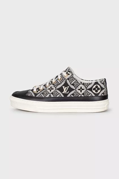 Blue textile sneakers with a signature print