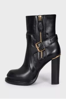 Leather ankle boots with a zip and strap