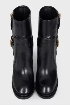 Leather ankle boots with a zip and strap