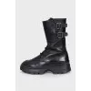 Black boots with a wide strap