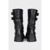 Black boots with a wide strap