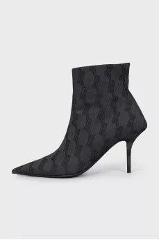 Ankle boots with heels in a signature print