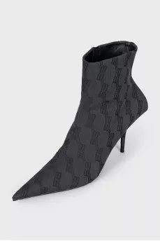 Ankle boots with heels in a signature print