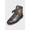 Leather boots with studs on the soles