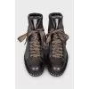 Leather boots with studs on the soles