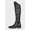 Black leather pointed toe boots