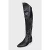 Black leather pointed toe boots