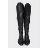 Black leather pointed toe boots