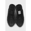 Black sneakers with embossed logo