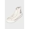 White textile sneakers with a brand logo