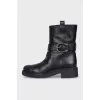 Black boots with metallic decor