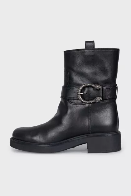 Black boots with metallic decor